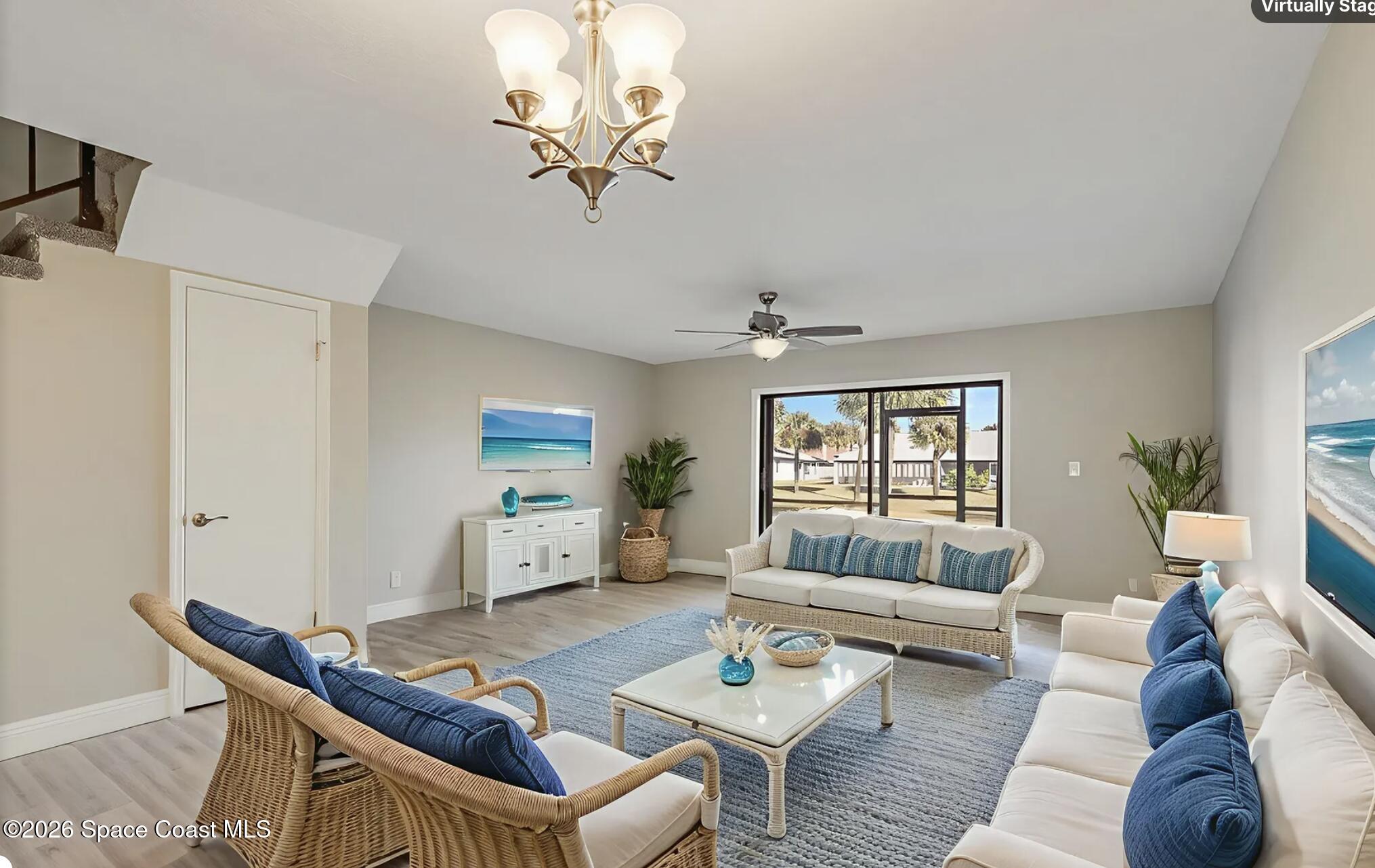 720 Palm Springs Circle Indian Harbour Beach, FL 32937 - Photo 18 of 57 a living room with furniture and a window