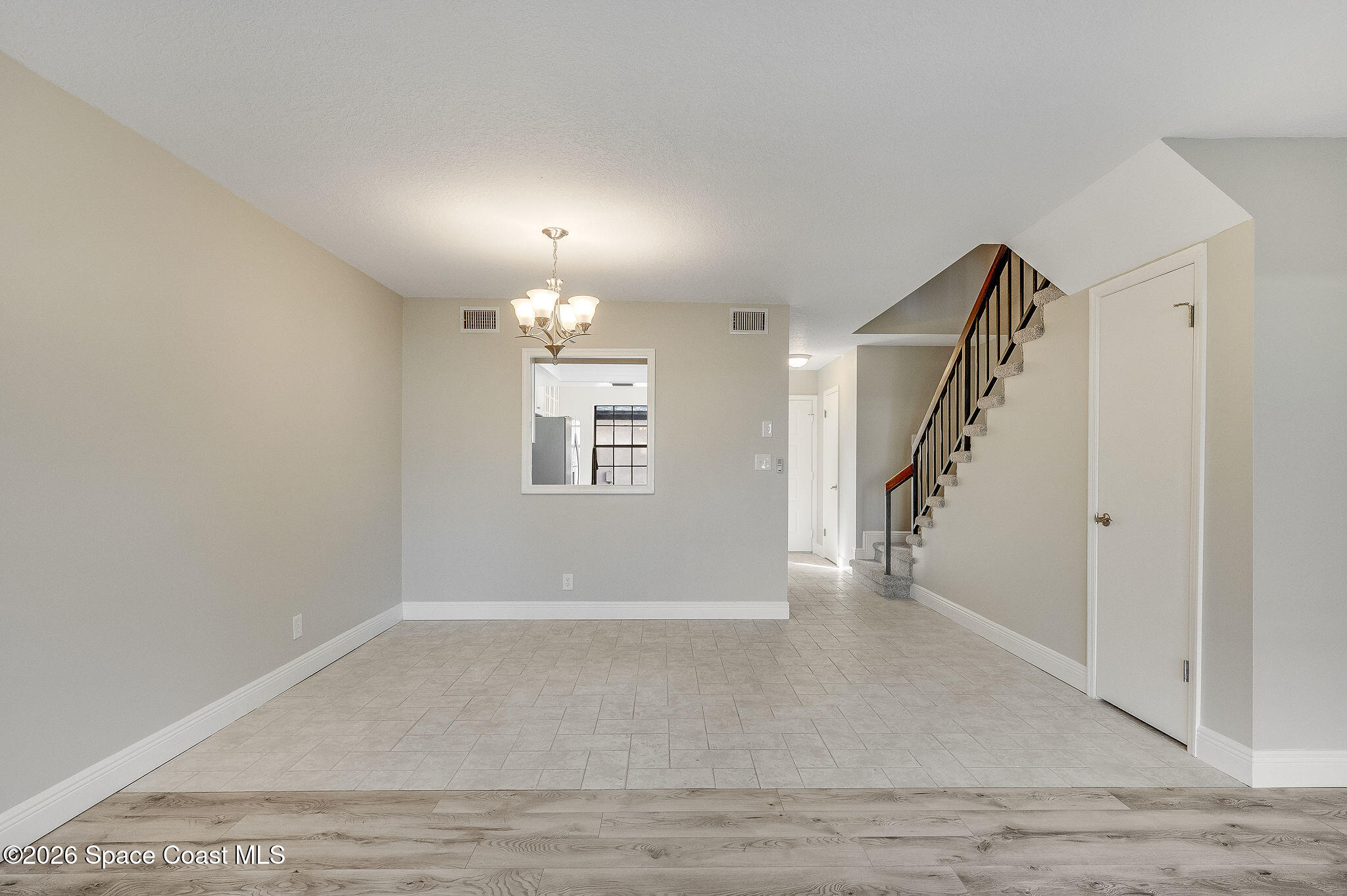 720 Palm Springs Circle Indian Harbour Beach, FL 32937 - Photo 21 of 57 a view of entryway and hall with wooden floor