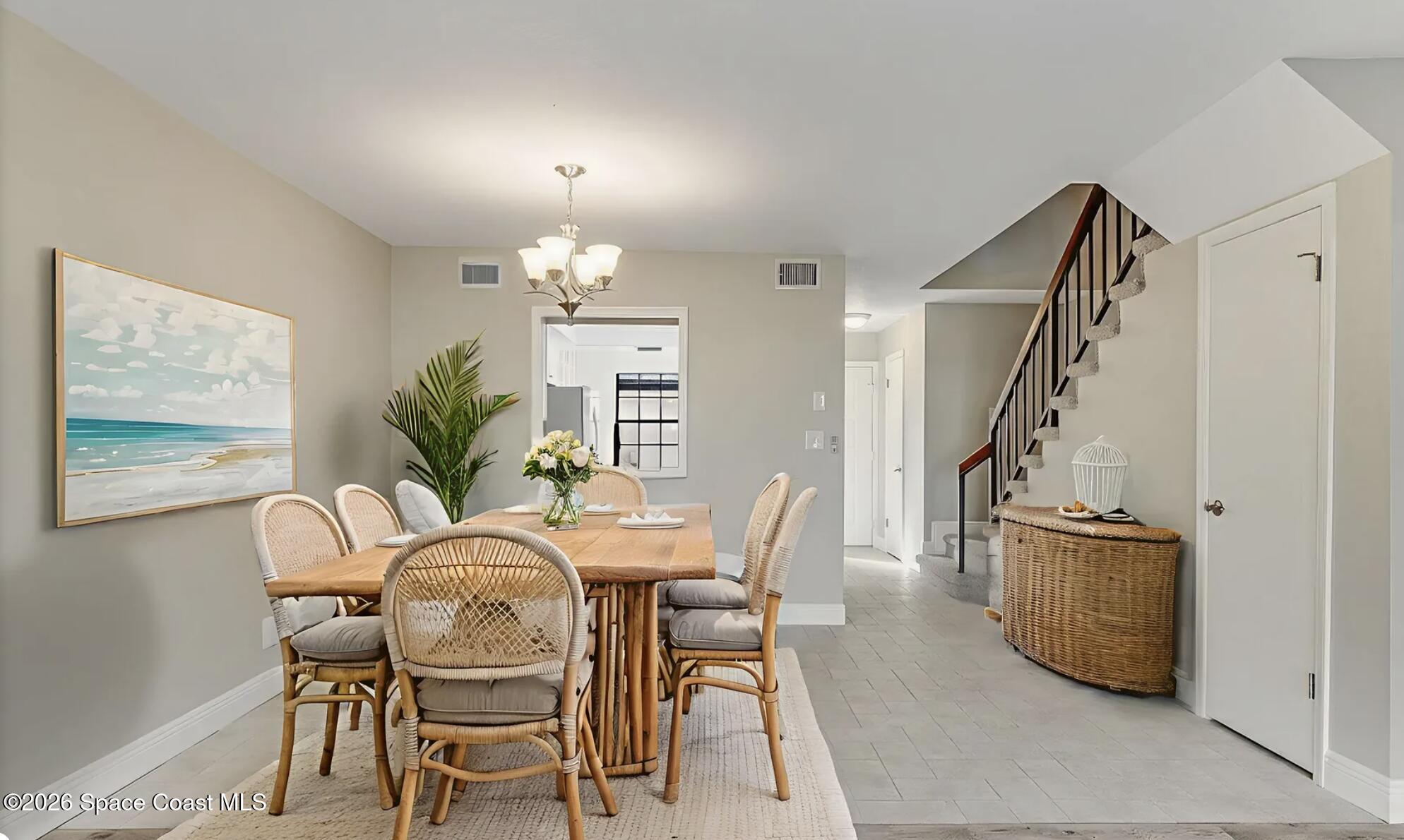 720 Palm Springs Circle Indian Harbour Beach, FL 32937 - Photo 22 of 57 a dining room with furniture and window