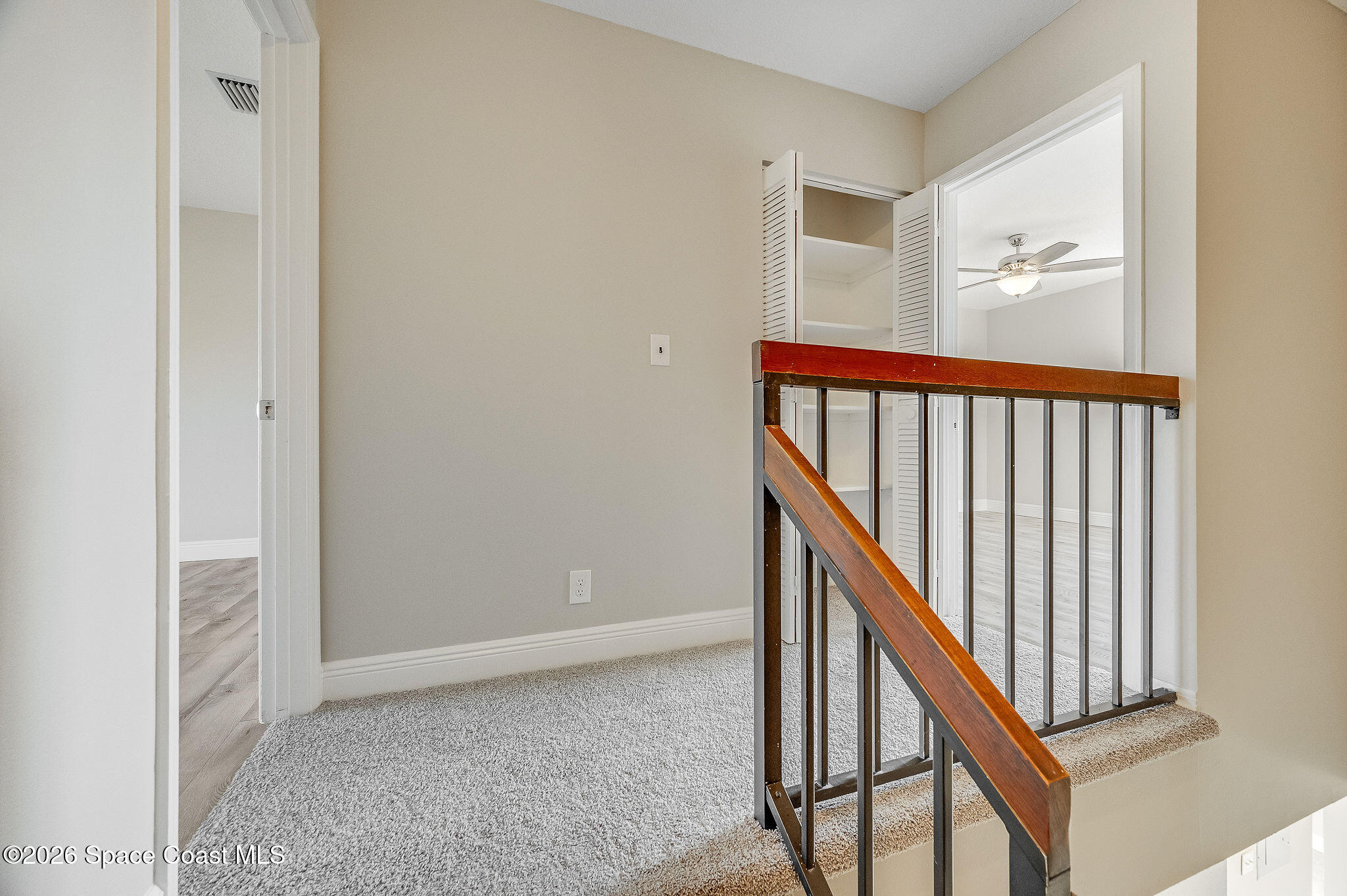 720 Palm Springs Circle Indian Harbour Beach, FL 32937 - Photo 25 of 57 a view of a hallway with staircase