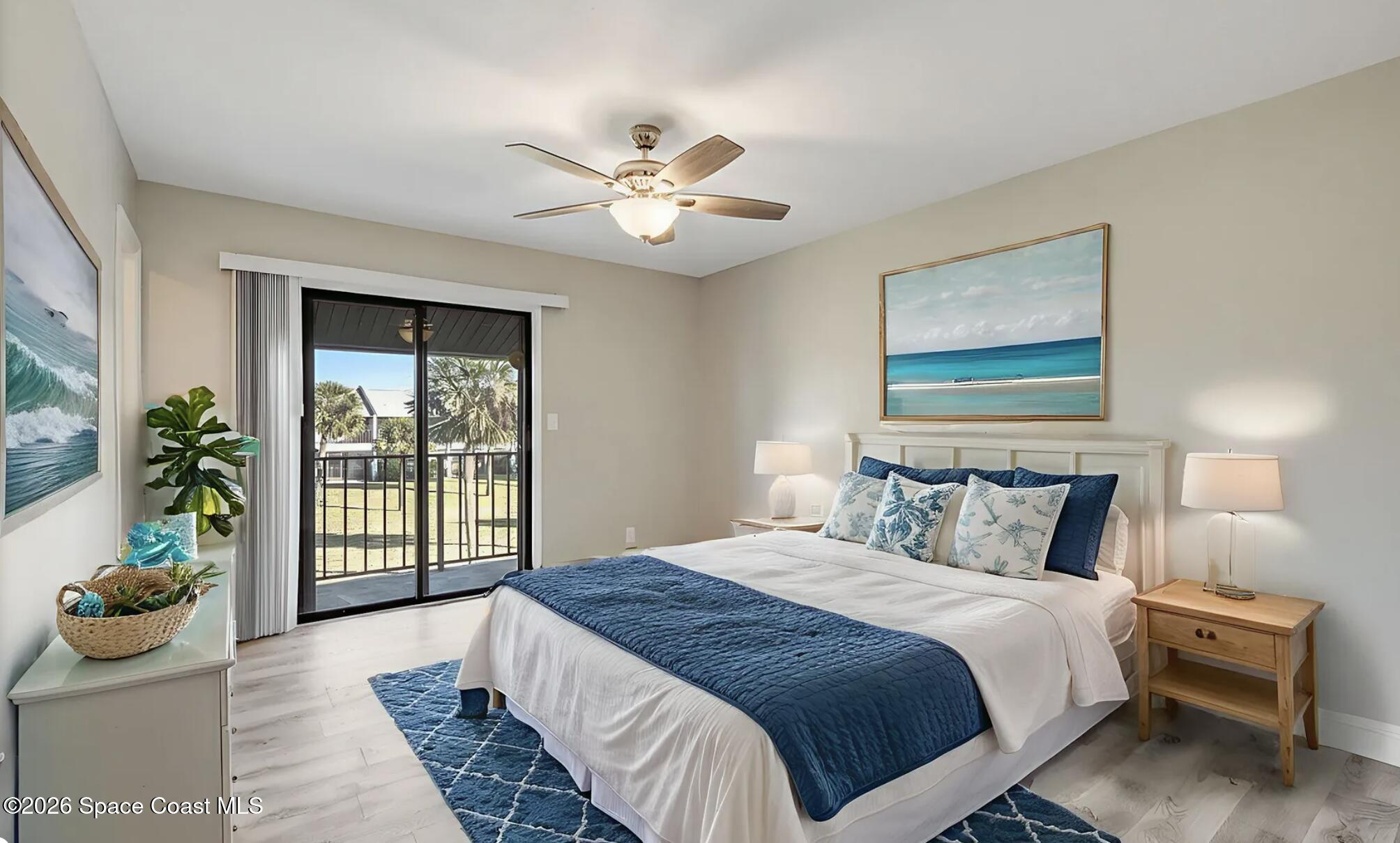 720 Palm Springs Circle Indian Harbour Beach, FL 32937 - Photo 29 of 57 a bedroom with a large bed and a window