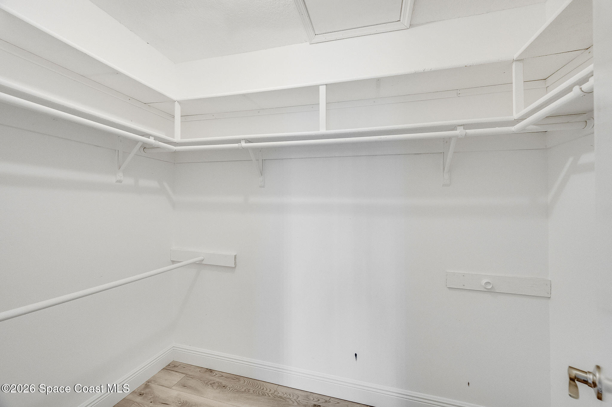 720 Palm Springs Circle Indian Harbour Beach, FL 32937 - Photo 32 of 57 a view of an empty walk in closet