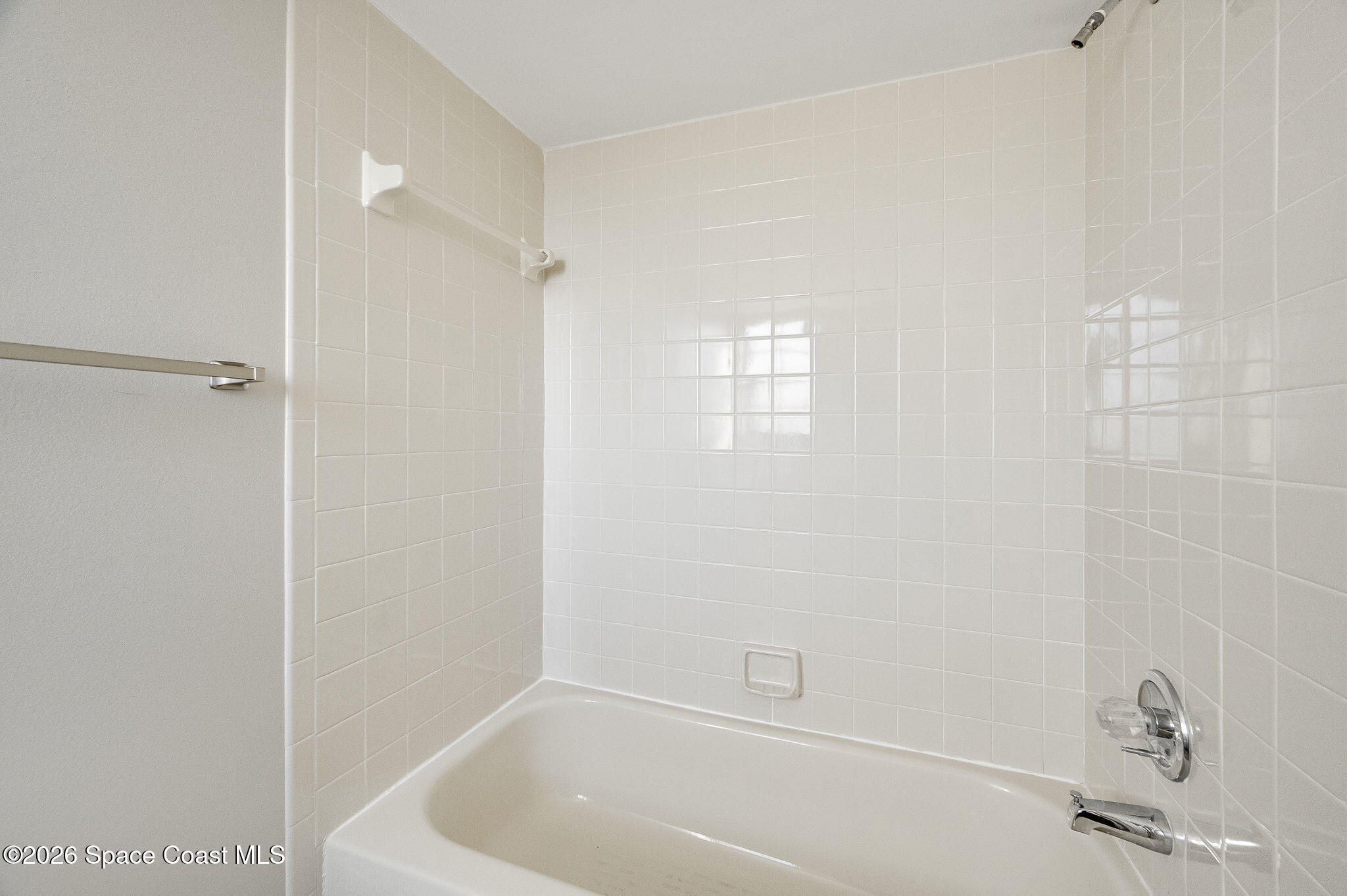 720 Palm Springs Circle Indian Harbour Beach, FL 32937 - Photo 38 of 57 a bathroom with a bathtub