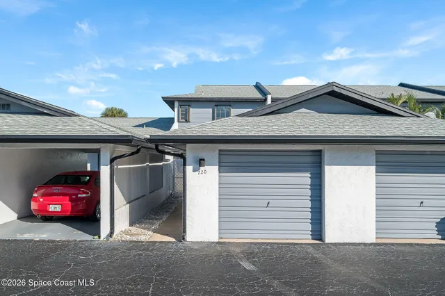 an aerial view of a residential apartment building with a yard