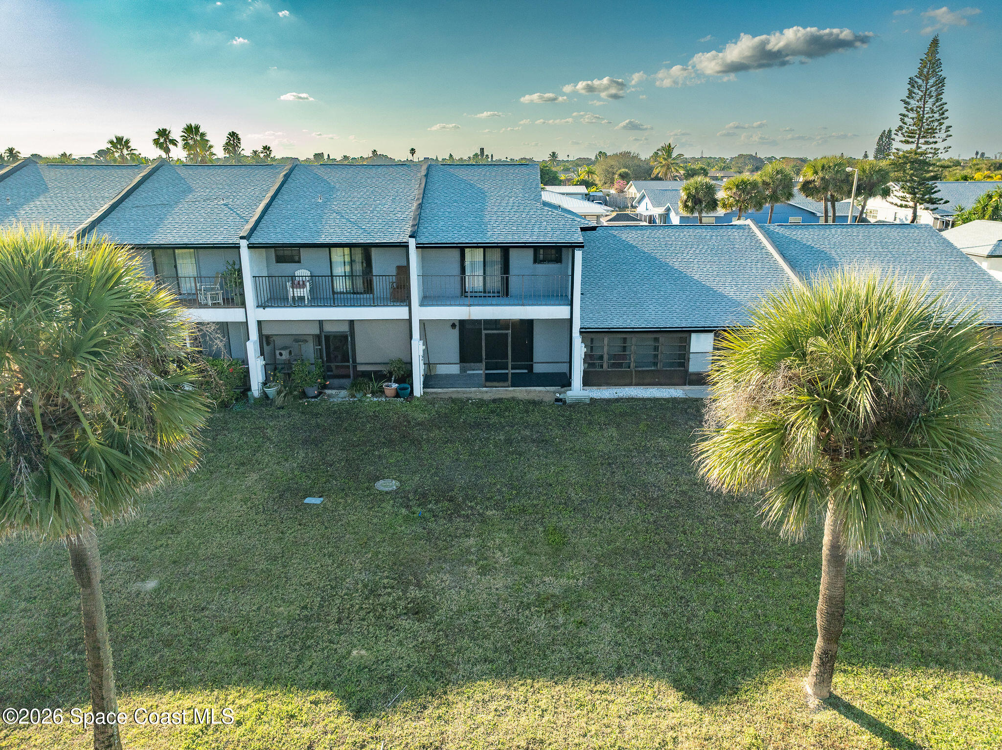 720 Palm Springs Circle Indian Harbour Beach, FL 32937 - Photo 51 of 57 a aerial view of multiple houses