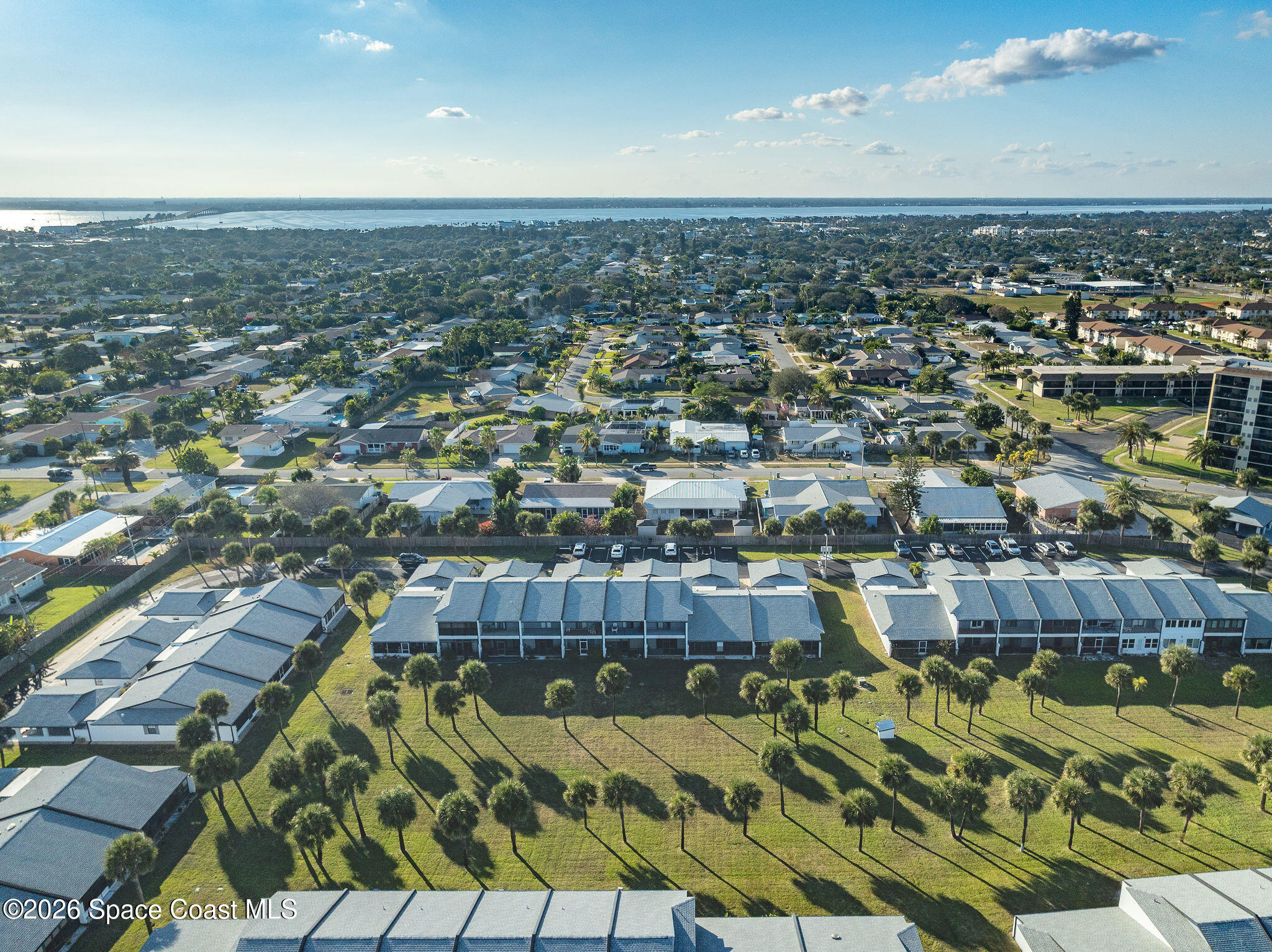 720 Palm Springs Circle Indian Harbour Beach, FL 32937 - Photo 54 of 57 an aerial view of residential houses with outdoor space