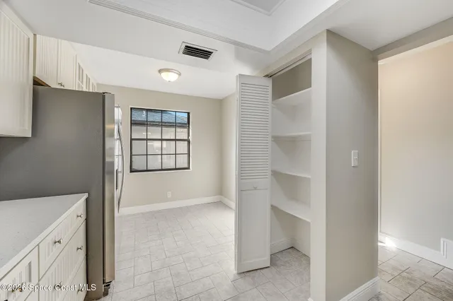 a kitchen with a sink cabinets and window