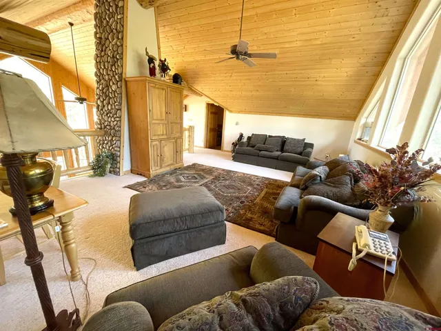 a bedroom with a bed and flat screen tv