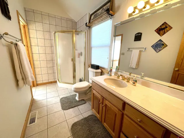 a view of a patio with iron fence