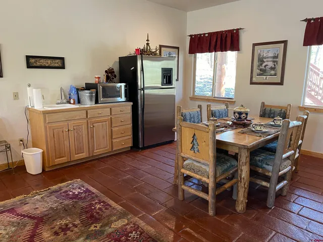 a bedroom with a bed dresser and a window