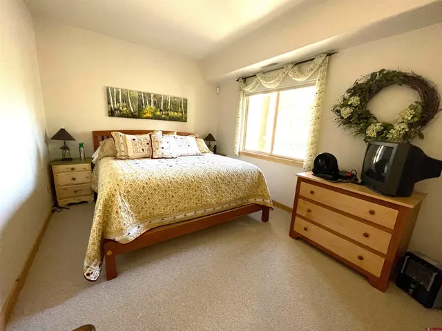 a bathroom with a sink toilet and a mirror