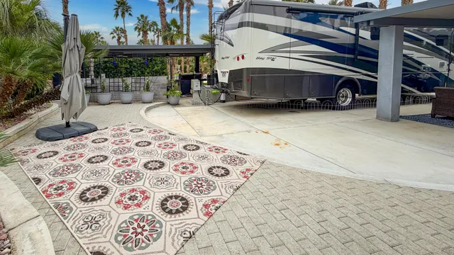 a view of balcony with a table and chairs
