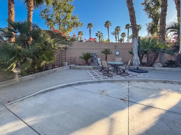 a view of a backyard with a sitting area
