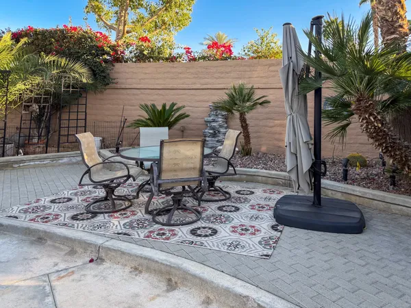 a view of a backyard with a patio