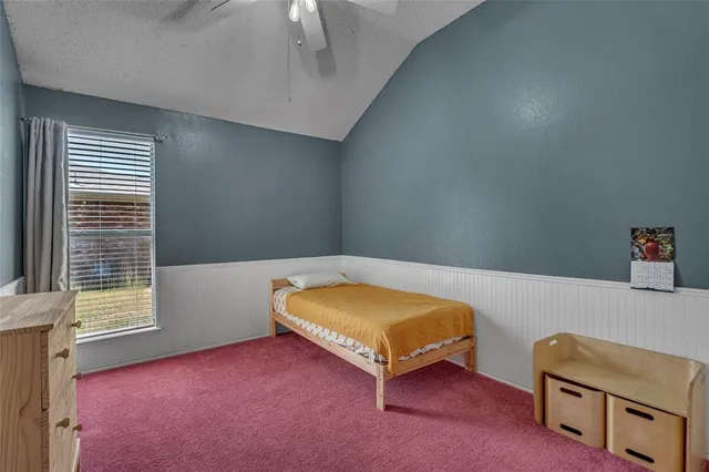 a room with a bed and a chair