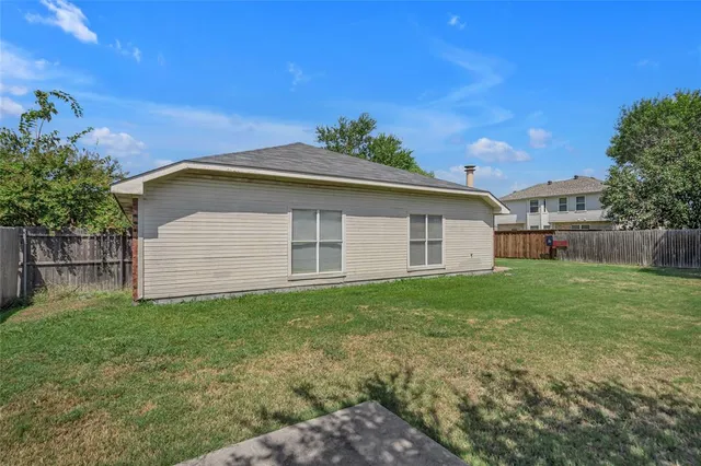 a backyard of a house with lots of green space