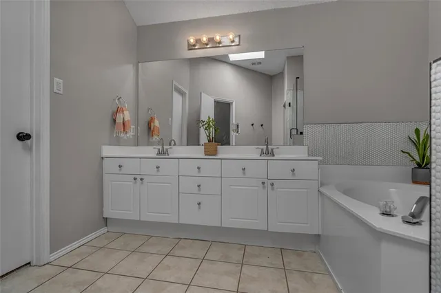 a bathroom with a sink a vanity and a mirror