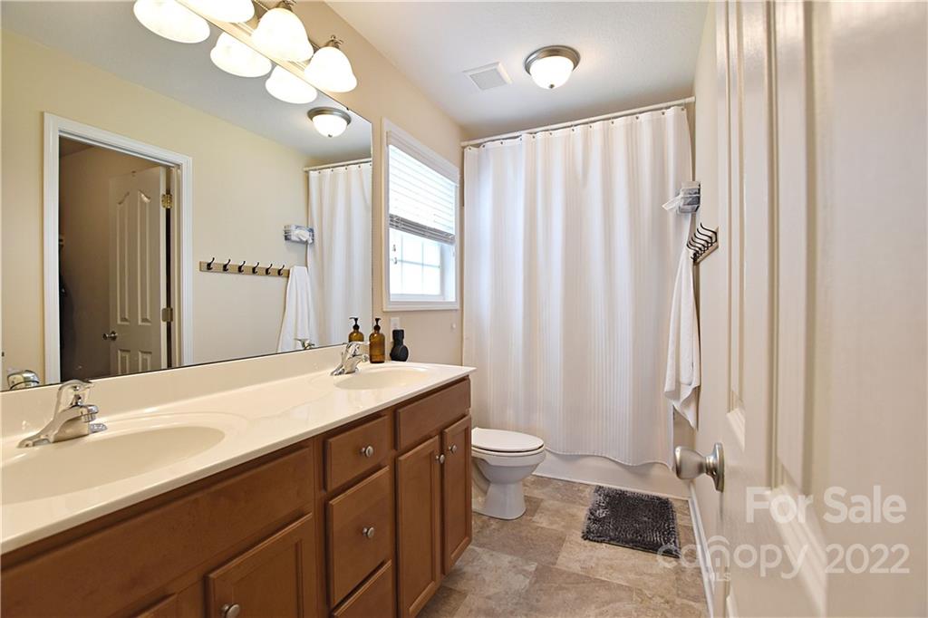 457 Rutledge Drive Catawba, SC 29704 - Photo 8 of 15 a bathroom with a sink a mirror and a toilet