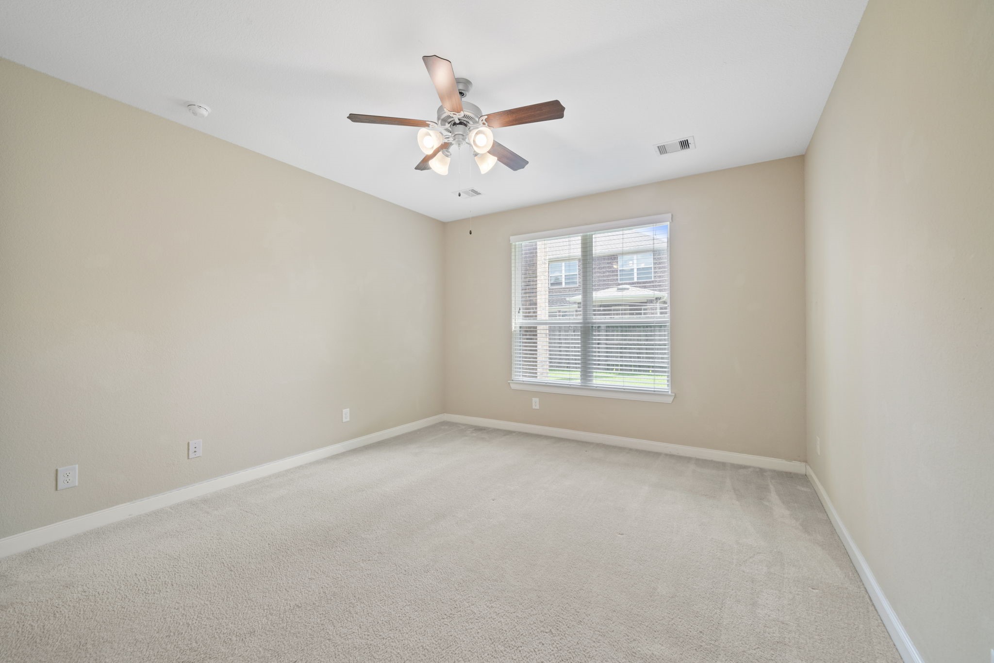 22523 Birch Ridge Meadow Drive Spring, TX 77389 - Photo 21 of 39 an empty room with windows and fan