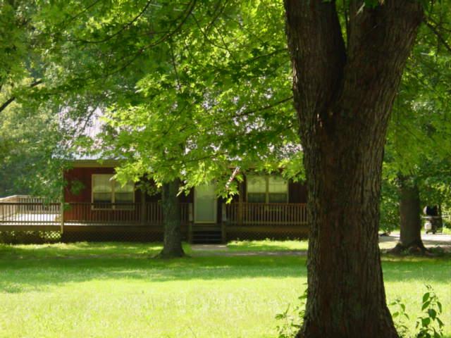 531 West Harper Road Portland, TN 37148 - Photo 18 of 20 LEVEL TREE-STUDDED YARD
