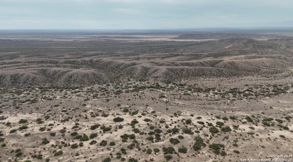 a view of ocean and mountain