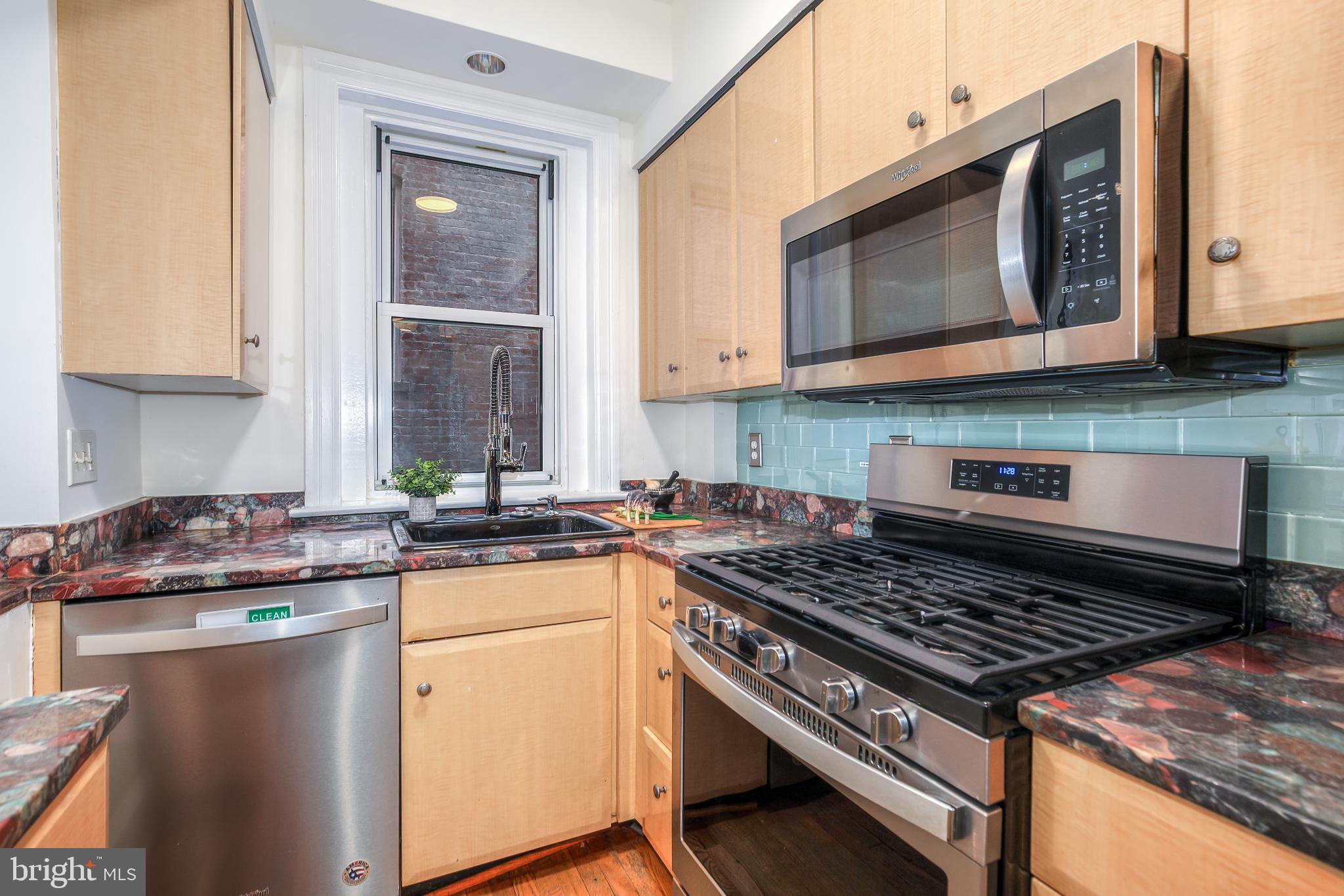 1954 Columbia Road Northwest, Unit 201 Washington, DC 20009 - Photo 17 of 41 Modern kitchen with sleek appliances.