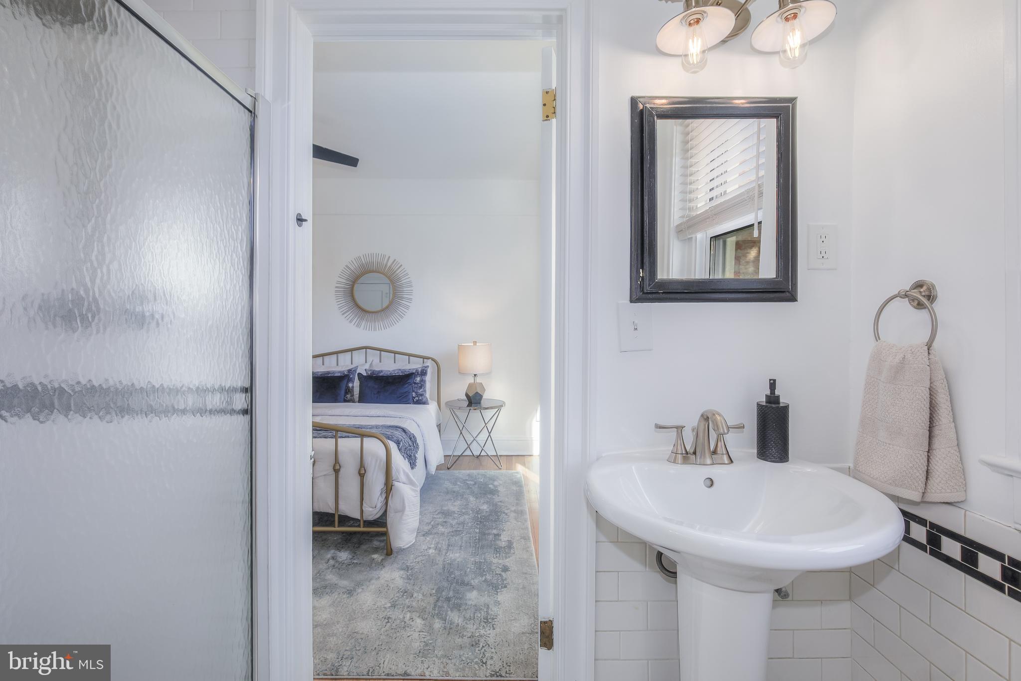 1954 Columbia Road Northwest, Unit 201 Washington, DC 20009 - Photo 31 of 41 Charming bathroom with serene bedroom view.
