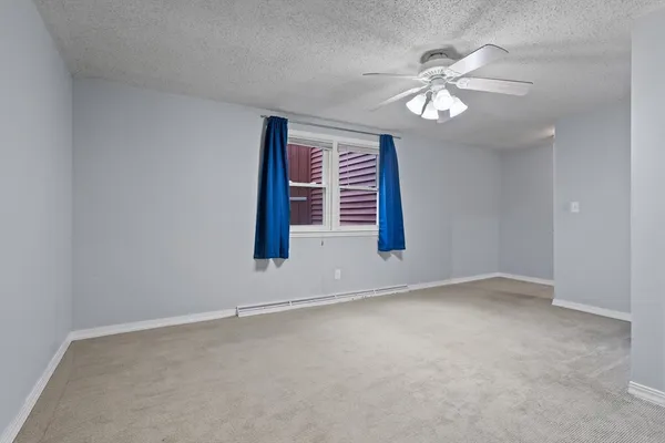 a view of a room with wooden floor and stairs