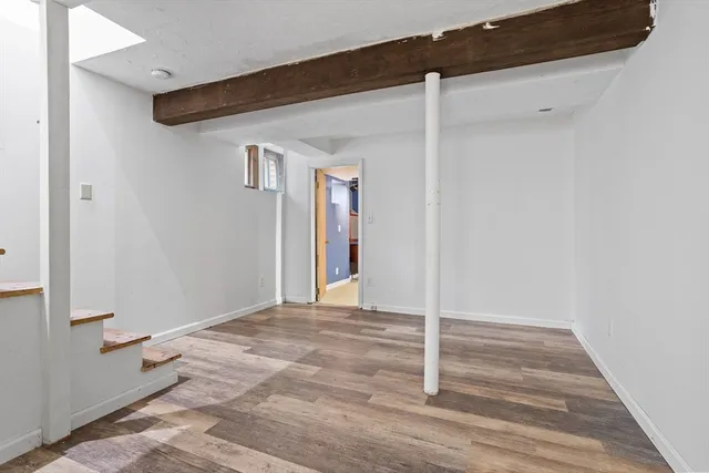 a bedroom with a bed and a desk