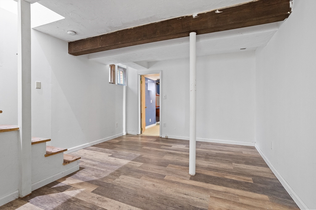 16 Middlesex Street, Unit 4 Chelmsford, MA 01863 - Photo 19 of 25 a view of a livingroom with wooden floor and closet