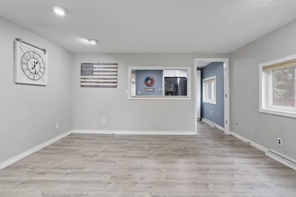 a view of an empty room with a window