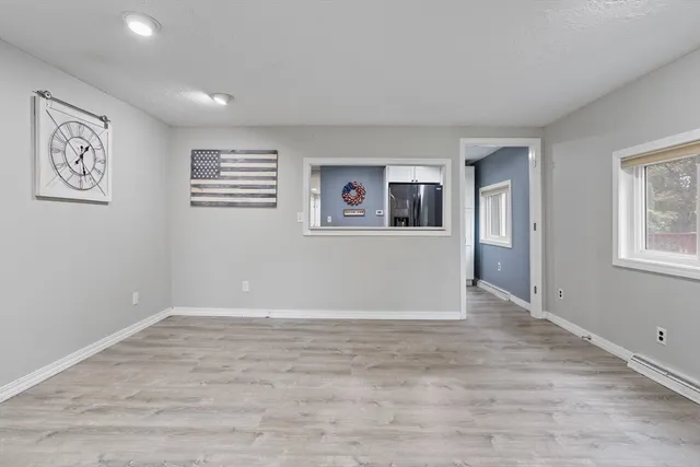 a view of an empty room with a window
