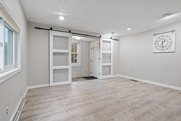 a view of an empty room with a window