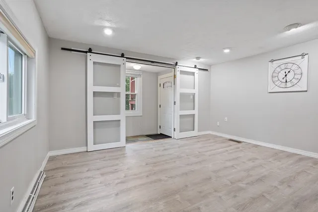 a view of an empty room with a window