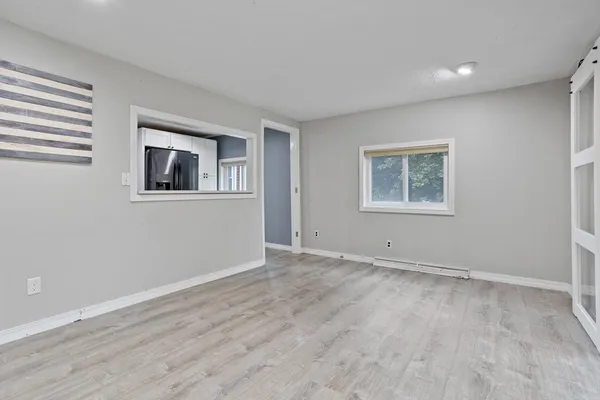 a view of an empty room with a window