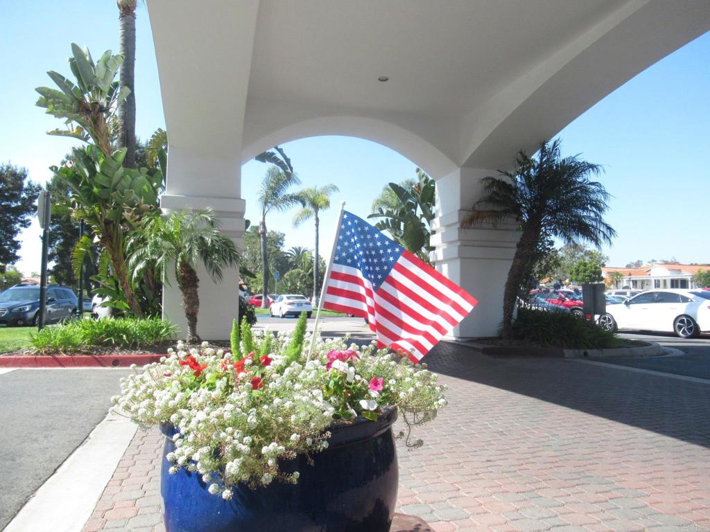 4939 Tilos Way Oceanside, CA 92056 - Photo 42 of 49 a view of a street with flowers and cars park