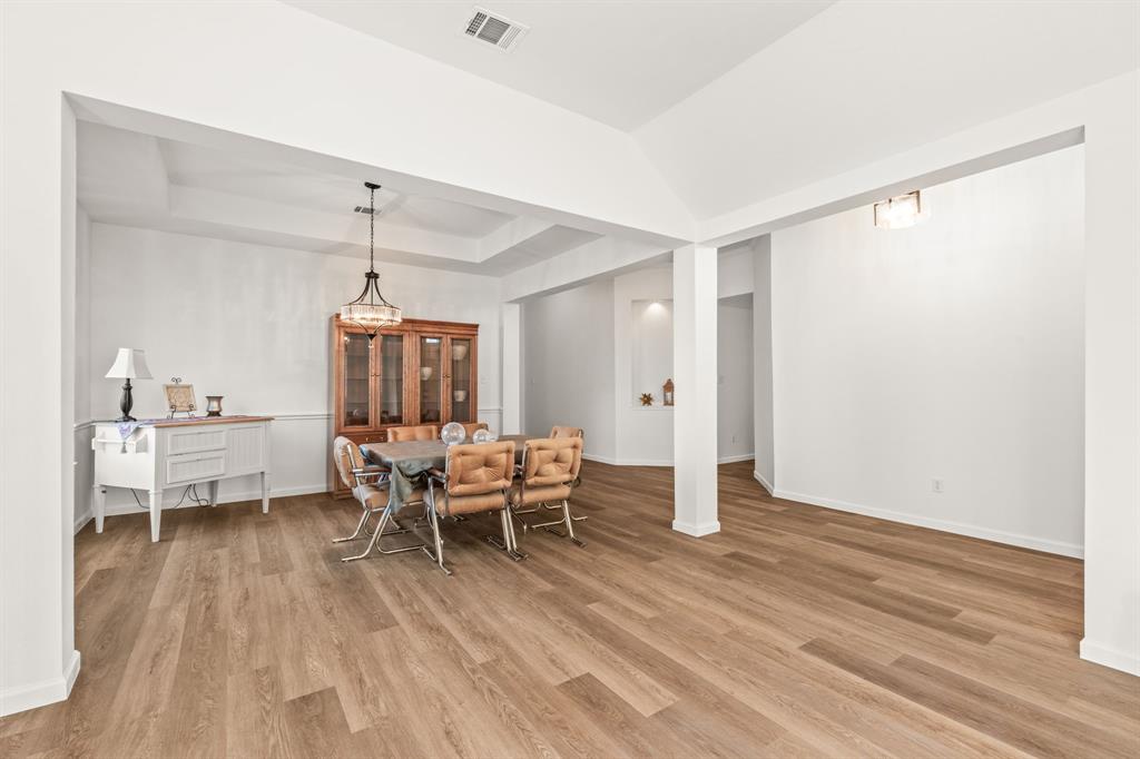 205 Crepe Myrtle Lane Murphy, TX 75094 - Photo 8 of 33 a living room with furniture and a wooden floor