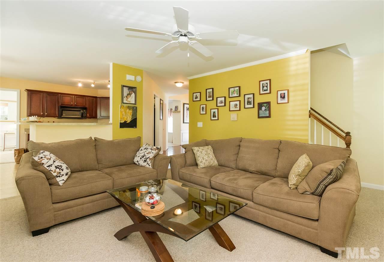 4809 Hodfield Court Raleigh, NC 27604 - Photo 12 of 22 a living room with furniture and a flat screen tv