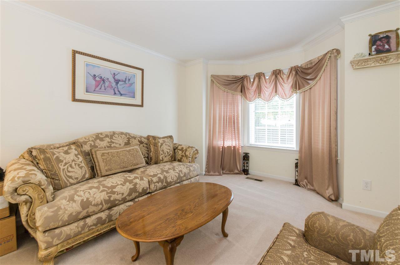 4809 Hodfield Court Raleigh, NC 27604 - Photo 4 of 22 a living room with furniture and a window