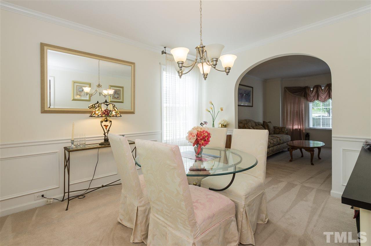 4809 Hodfield Court Raleigh, NC 27604 - Photo 5 of 22 a view of a dining room with furniture and a chandelier