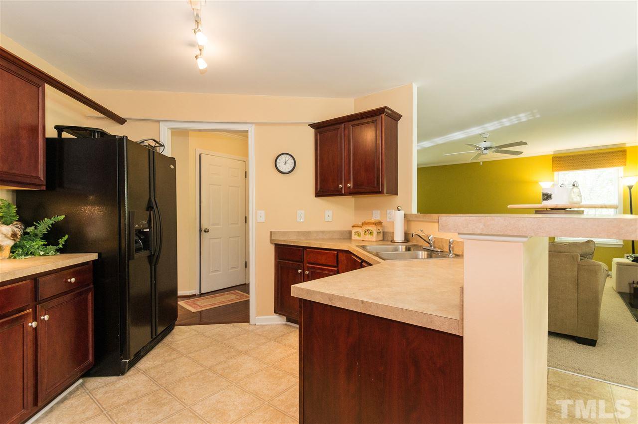 4809 Hodfield Court Raleigh, NC 27604 - Photo 6 of 22 a kitchen with a sink stove and refrigerator