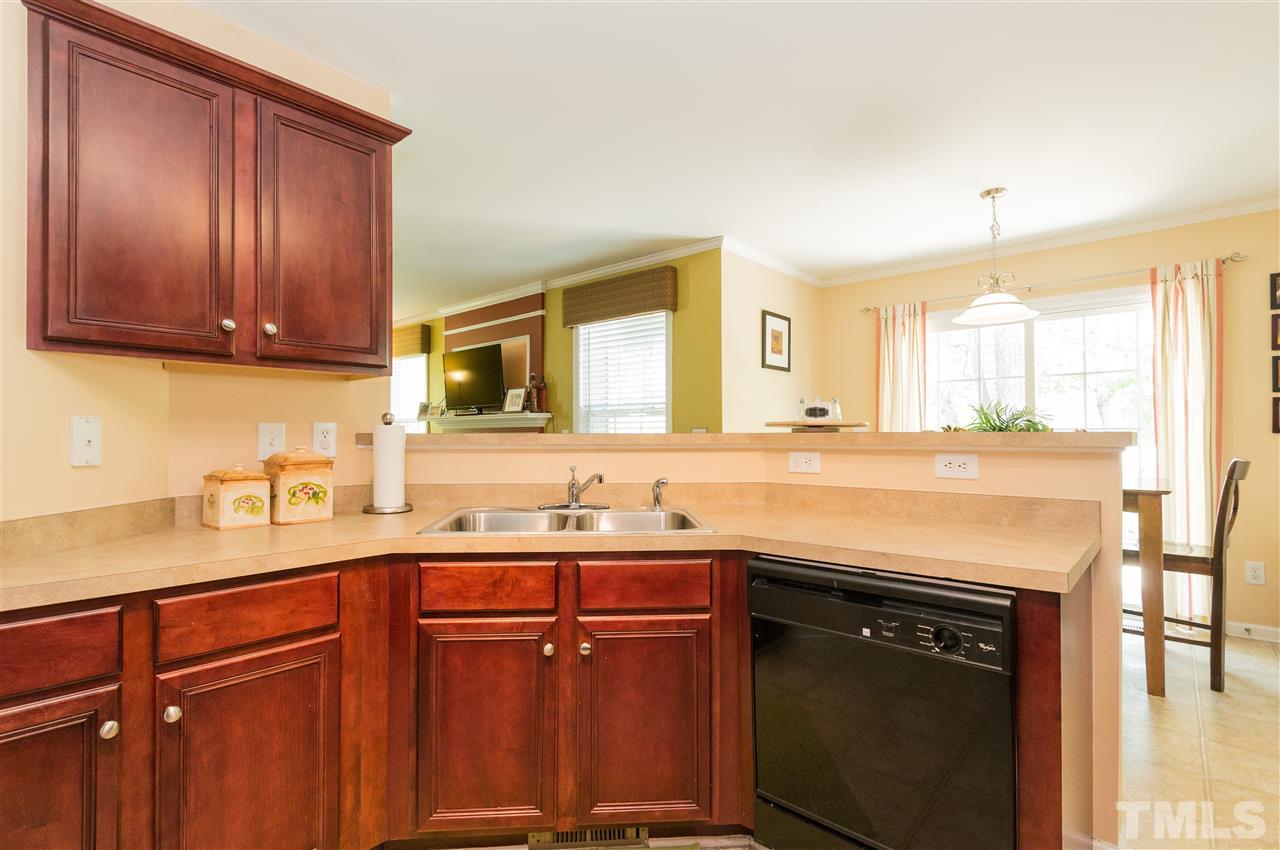 4809 Hodfield Court Raleigh, NC 27604 - Photo 7 of 22 a kitchen with a sink and a cabinets