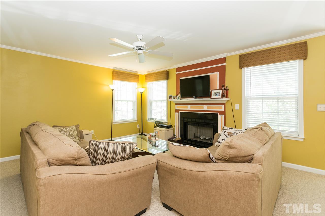 4809 Hodfield Court Raleigh, NC 27604 - Photo 10 of 22 a living room with furniture and a fireplace
