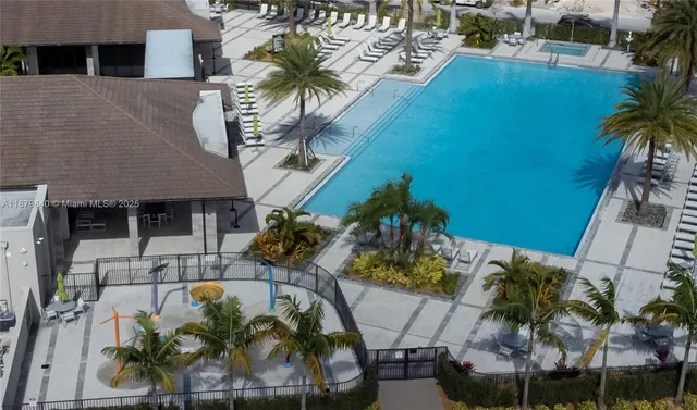 an aerial view of multiple houses with yard
