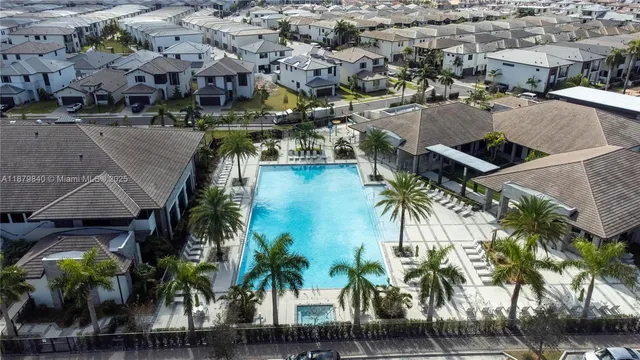 a living room with furniture and flowers