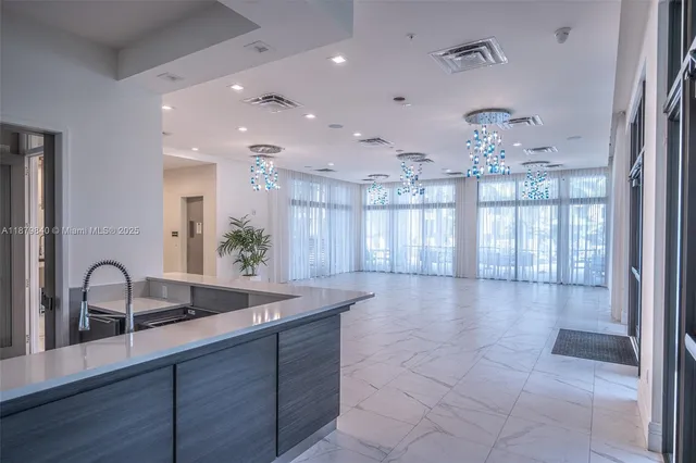a view of a house with potted plants and a table