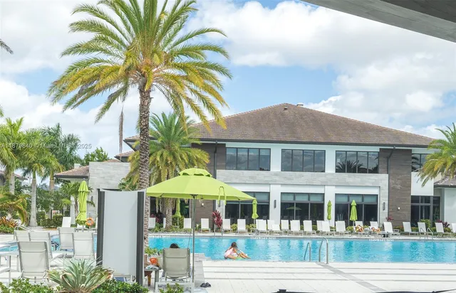 a view of swimming pool with a table and chairs