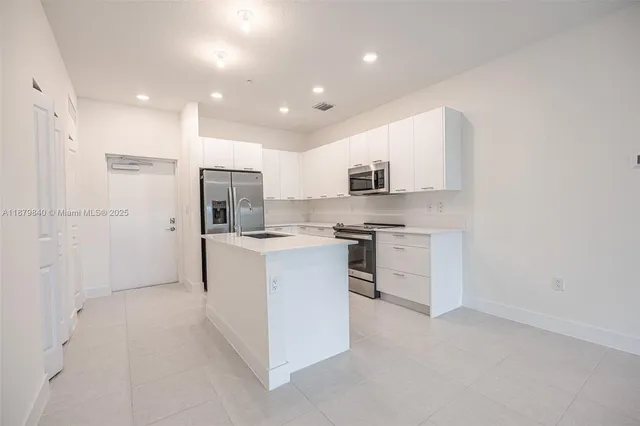 a view of storage and utility room with washer and dryer