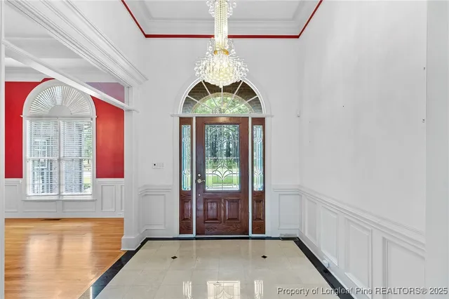 a view of entryway with window and chandelier