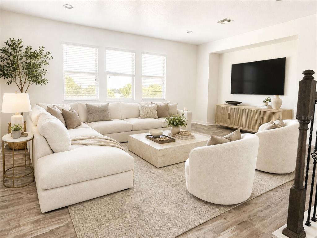8531 Geddes Loop Orlando, FL 32836 - Photo 9 of 20 a living room with furniture and a flat screen tv